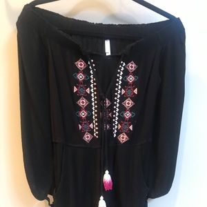 Black long sleeve romper with tribal detail
